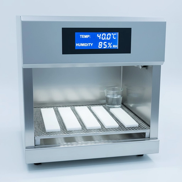 Environmental chamber testing of fiberglass cast coupons at controlled temperature and humidity